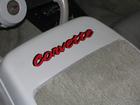 corvette lettering on seat backs of 82 corvette.  Cross flags on rear window.