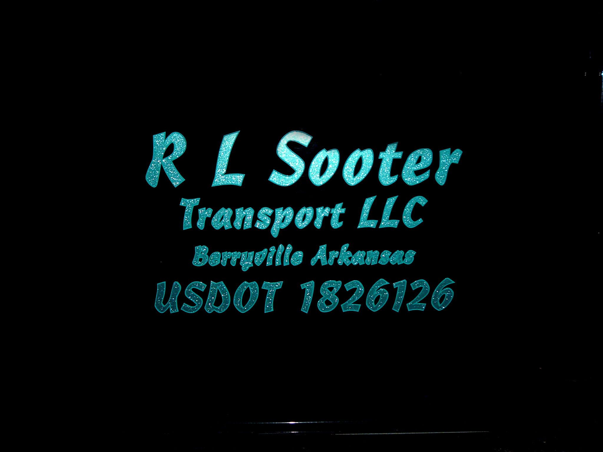Black 2004 Volvo 780 at night.