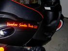 Red reflective lettering on the company scooter