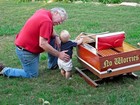 My dad and my son with his first wooden boat.