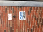 Dick Hours Sign on Building